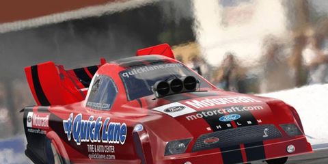 Bob Tasca, above, took the qualifying lead in NHRA Funny Car action Friday in Bristol.