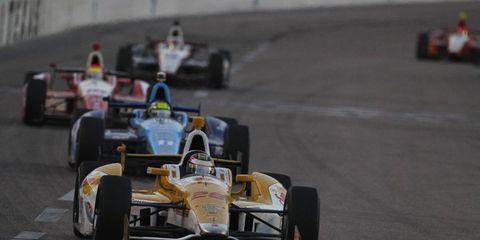 Ryan Hunter-Reay leads the way at Texas, followed by Tony Kanaan and eventual winner, Justin Wilson. AP writer Jenna Fryer makes a compelling case for races to stay at Texas Motor Speedway.