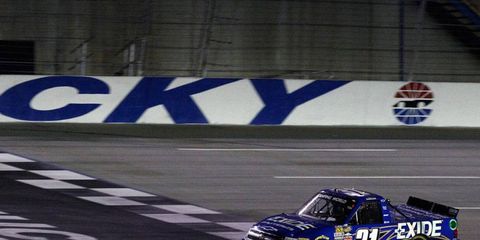 James Buescher won the first race of a busy weekend in Kentucky that will include a Nationwide Series race on Friday and a Sprint Cup Series race on Saturday.