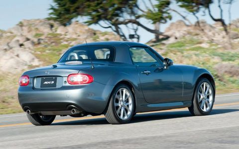 The power retractable hard top on the 2012 Mazda MX-5 Miata PRHT adds enough weight to make a purist think twice, but it does look great.