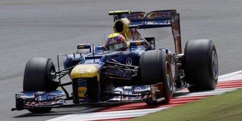 Formula One driver Mark Webber and Red Bull Racing have extended their deal to run through the 2013 season.
