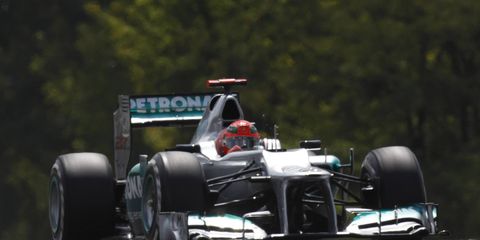 Michael Schumacher spun out for the second week in a row during Formula One practice. On Friday, he slid on the wet track and slid into the wall.