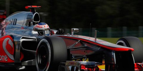 Jenson Button captured his first Formula One pole for McLaren on Saturday in his 50th race weekend with the team.