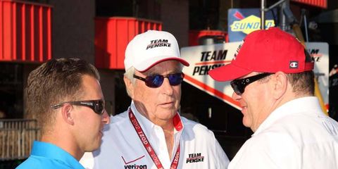 Oh, to be a fly on this wall. A.J. Allmendinger (left) talks with Roger Penske (center) and Chip Ganassi (right) at Saturday's IndyCar finale in Fontana. Could an IndyCar deal for Dinger be in the works?