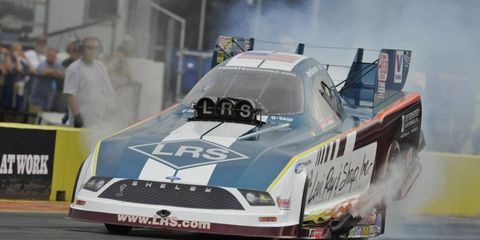 Tim Wilkerson took the top spot in Funny Car qualifying in NHRA action on Friday.