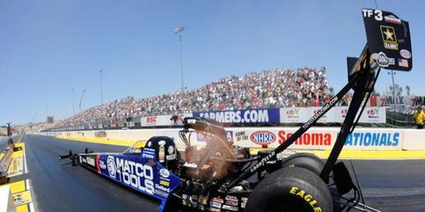 Antron Brown was the top NHRA driver in Top Fuel qualifying on Friday night in St. Louis.