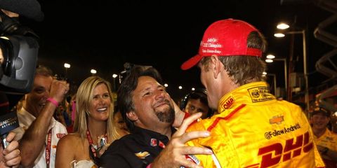 Michael Andretti embraces Ryan Hunter-Reay, who recently won the IndyCar championship.