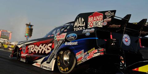 Courtney Force set the pace in the Funny Car class at Ennis, Tex., on Friday.