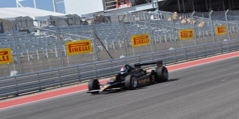 Mario Andretti races around the newly completed Circuit of the Americas race track.