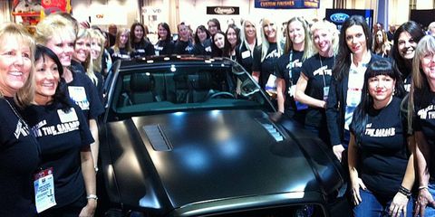 The 40 female designers and engineers stand with their Ford Mustang creation at the 2012 SEMA show.