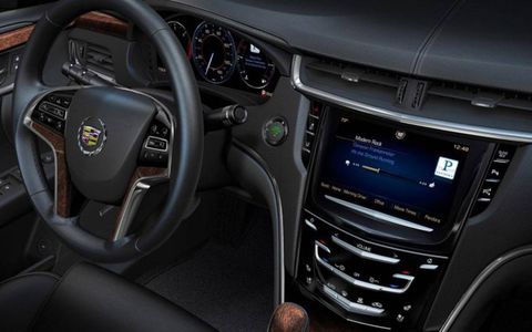 The CUE infotainment system on the 2013 Cadillac XTS Premium Collection earned mixed reviews, with some editors feeling its complexity overwhelmed the nice features it offered.