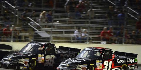 James Buescher took advantage of a late crash by Ty Dillon to take the Camping World Truck Series championship on Friday at Homestead.