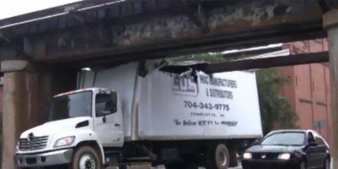 This overpass peels off truck roofs as easily as you'd open a sardine can--and it's oddly hypnotizing to watch.