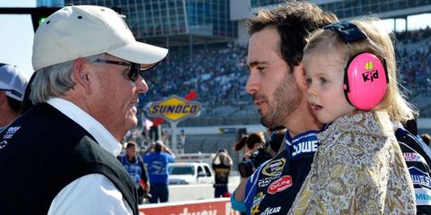 Jimmie Johnson with team owner Rick Hendrick, left, and Johnson's daughter Evie last week at Texas.