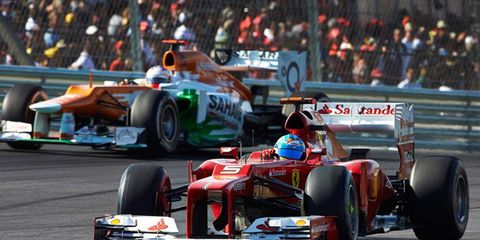 Ferrari's Fernando Alonso remains in the hunt for a Formula One championship thanks in part to a move by the team on Sunday that cost teammate Felipe Massa.