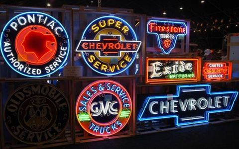 Coincidence? The only sign not lit up in this display of vintage neon: Oldsmobile. It's the only brand shown here that is defunct.
