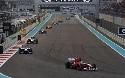 Tenth place Felipe Massa leads a line of cars in his Ferrari F10