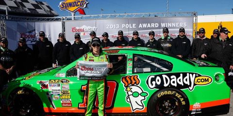Danica Patrick shows off the spoils of winning the pole for the Daytona 500.