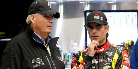 Team owner Rick Hendrick, left, and Jeff Gordon talk before the Sprint Unlimited at Daytona International Speedway.