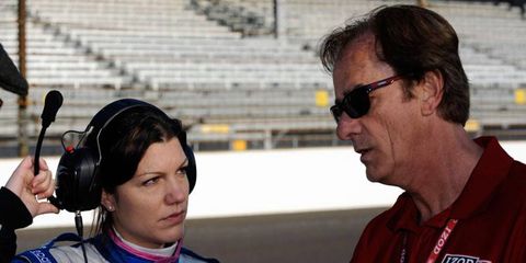 Katherine Legge, left, talks with driving coach Arie Luyendyk last year at Indianapolis.