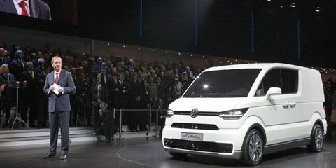 VW's Dr. Eckhard Scholz presents the electric e-CO-motion concept at the 2013 Geneva motor show.