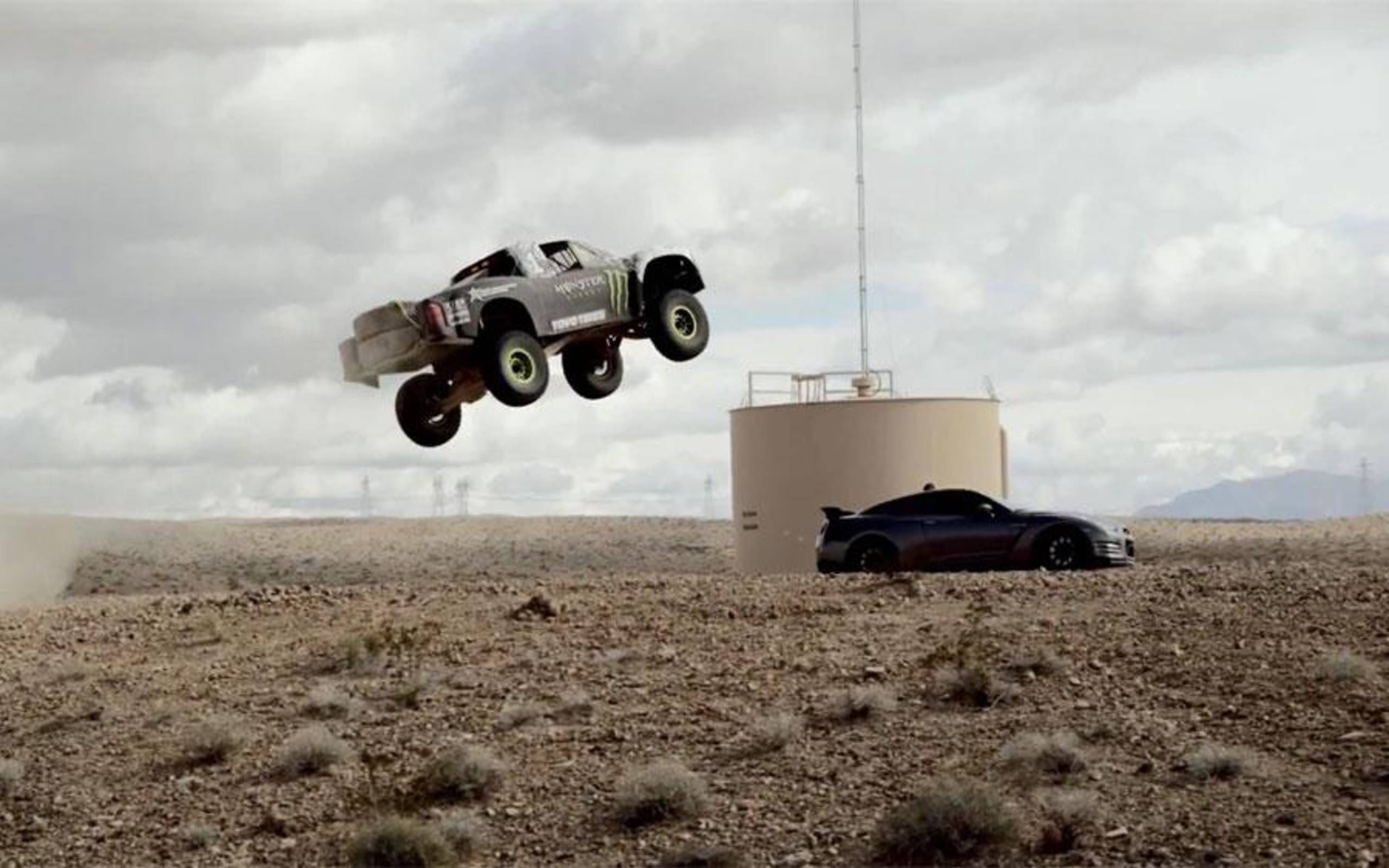 Rocking-across-desert-with-Baldwin,-Monster-Energy-truck