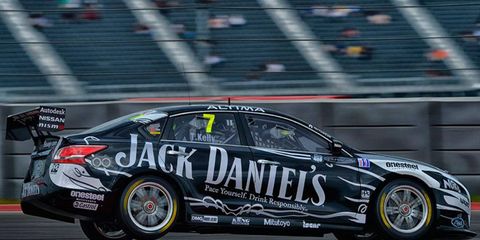 V8 Supercars driver Todd Kelly takes on the curbs at Circuit of the Americas in his Nissan Altima on Friday.
