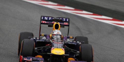 Sebastian Vettel put a damper on Fernando Alonso's homecoming on Friday, beating out the Spaniard on his home turf.