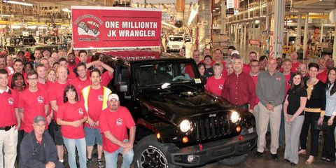 The one-millionth Jeep Wrangler JK surrounded by the men and women who keep Jeep assembly lines rolling.