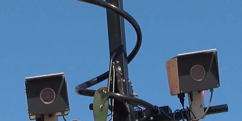 Judge Robert P. Ruehlman said the traffic cameras were a "sham," "scam" and the "entire case against the motorist is stacked."