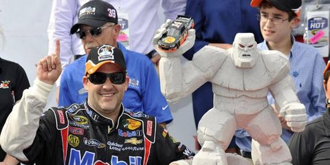Tony Stewart was all smiles after his win in Dover, but once he got into the media center, Smoke bared his teeth.