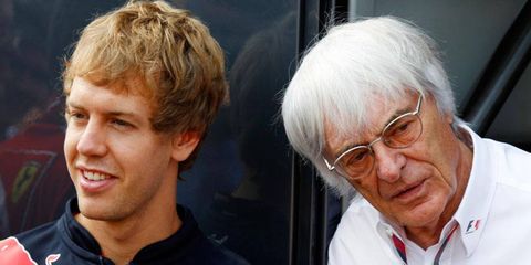 Three-time Formula One champion Sebastian Vettel, left, supports F1 boss boss Bernie Ecclestone.