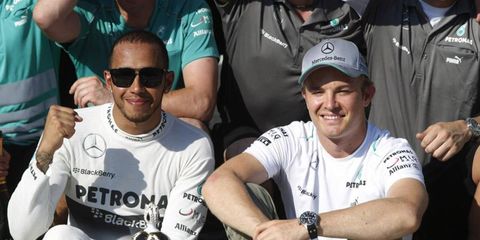 According to Mercedes boss Ross Brawn, Nico Rosberg (right) is extremely happy with Lewis Hamilton (left) as his teammate.