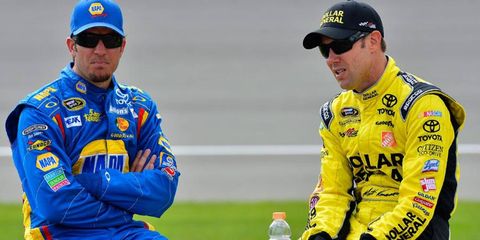 NASCAR Sprint Cup driver Matt Kenseth, right, hangs out on pit road with Martin Truex Jr. at Michigan International Speedway.