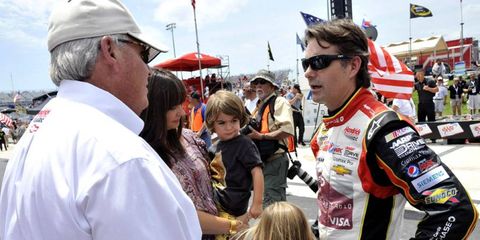 Rick Hendrick talks to his driver, Jeff Gordon, during a recent race weekend.