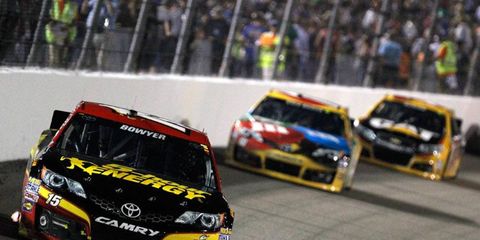 Team owner Michael Waltrip, Martin Truex Jr. and Clint Bowyer were all smiles after a Bowyer spin helped Truex during Saturday night's race at Richmond.