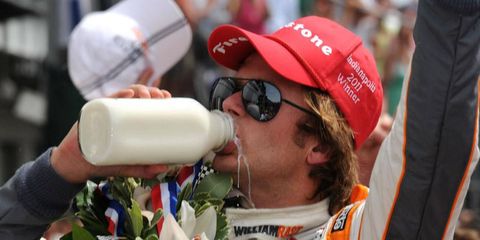 IndyCar driver Dan Wheldon drinks milk after winning the 2011 Indianapolis 500. Thursday marked the second anniversary of Wheldon's death.