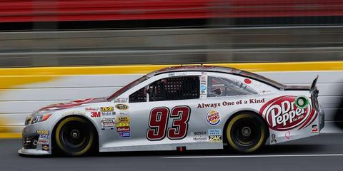 Travis Kvapil was back in the seat of his race car on Thursday, less than 48 hours after he was arrested and charged with assault.