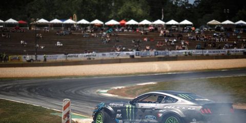 Vaughn Gittin Jr. powers his Ford Mustang through the course in an early practice run on the way to victory in the second round of Formula Drift in Atlanta.
