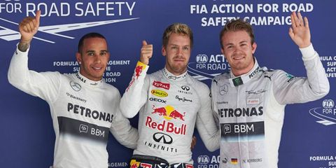 Lewis Hamilton, left, and Nico Rosberg, right, flank pole sitter Sebastian Vettel on Saturday at the Buddh International Circuit in India.