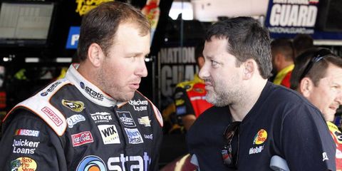 Tony Stewart, on crutches, talks to his teammate Ryan Newman. The complexion of the Chase could have been very different if Stewart remained healthy.
