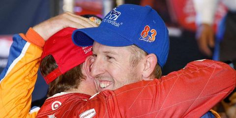 Charlie Kimball congratulates teammate Scott Dixon after Dixon's IndyCar championship clincher at Fontana.