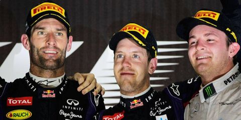 Mark Webber, Abu Dhabi Grand Prix winner Sebastian Vettel and Nico Rosberg shared the spotlight on the Formula One podium on Sunday.