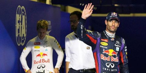 Mark Webber, right, took center stage from his teammate and four-time Formula One champion Sebastian Vettel on Saturday in Abu Dhabi.