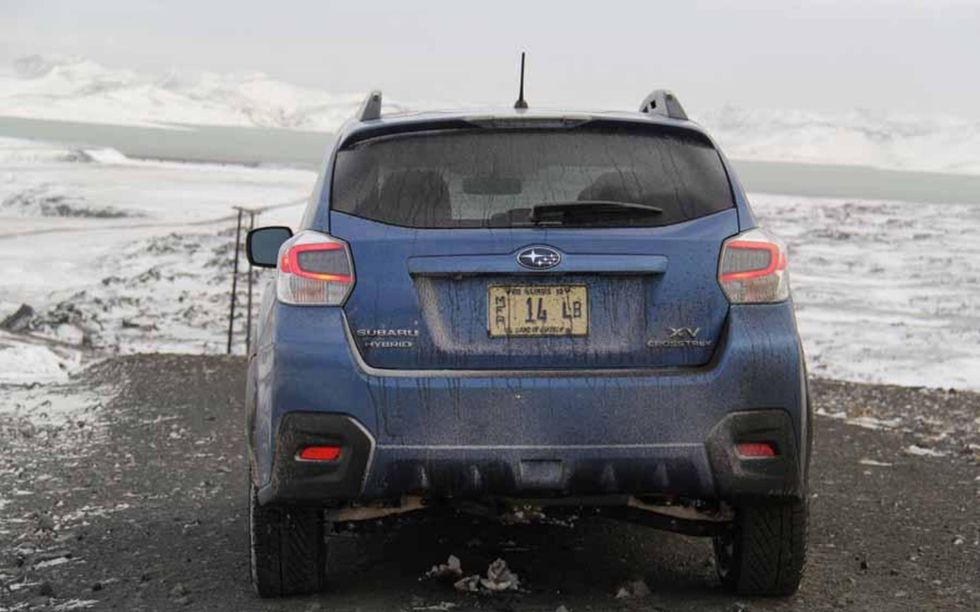 The Crosstrek Hybrid contemplates a rare patch of paved road in middle-of-nowhere Iceland.