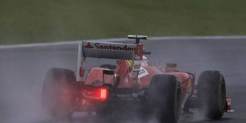 Drivers like Felipe Massa had to battle through the rain at Friday's practice session.