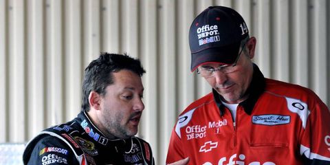 NASCAR Sprint Cup driver Tony Stewart talks to crew chief Steve Addington. Addington is leaving Stewart Haas Racing to join Phoenix Racing.