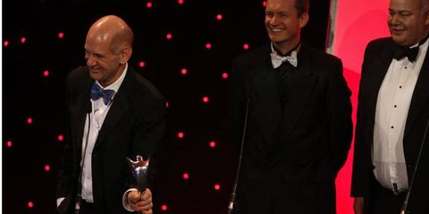 Adrian Newey accepts an award at the Autosport Awards.