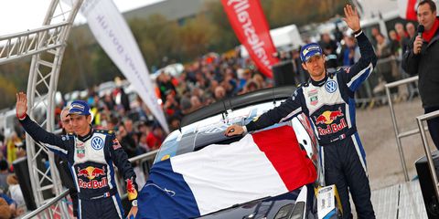 Sebastien Ogier and co-driver Julien Ingrassia celebrate their win for Volkswagen at Wales Rally Great Britain.