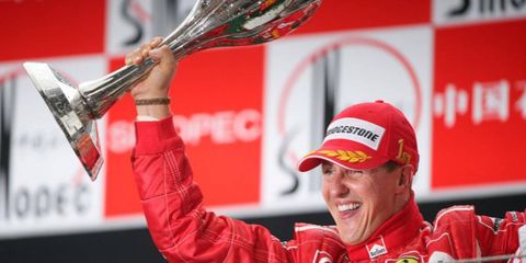 Michael Schumacher celebrates on the podium after winning the Chinese Grand Prix in 2006.